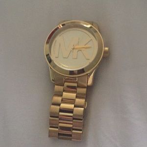 MK gold tone women’s watch
